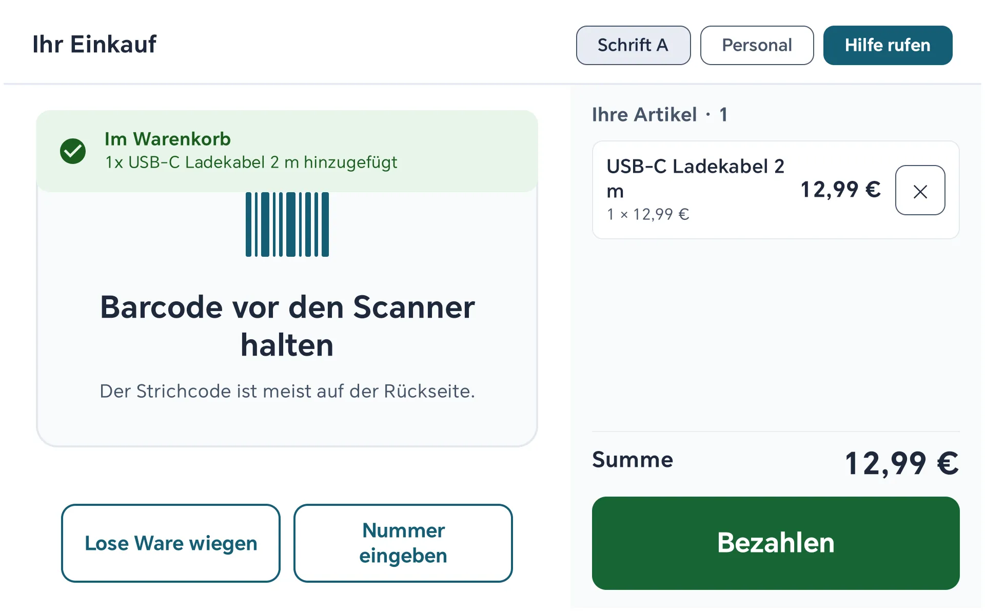 Selbstbedienungs-Kasse: ein USB-C Ladekabel für 12,99 Euro im Warenkorb, grüner Knopf Bezahlen